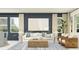 Stylish living room with ample seating, natural light, and contemporary decor in neutral tones at 4578 Ochos Rios Pl, Kissimmee, FL 34758