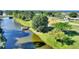 Aerial view of the canal behind the home with a boat dock at 6365 Avocado Dr, Indian Lake Estates, FL 33855