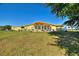 Expansive backyard with a large patio perfect for outdoor entertaining and enjoying the serene surroundings at 6365 Avocado Dr, Indian Lake Estates, FL 33855