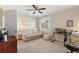 Comfortable bedroom featuring a ceiling fan, window with blind, and neutral decor at 6365 Avocado Dr, Indian Lake Estates, FL 33855