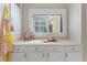 Bright kitchen with custom cabinets and ample counter space, perfect for cooking and entertaining with natural light at 6365 Avocado Dr, Indian Lake Estates, FL 33855