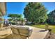 Inviting outdoor patio with comfortable seating, perfect for relaxing and enjoying the serene waterfront view at 6365 Avocado Dr, Indian Lake Estates, FL 33855