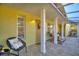 Charming front porch with stylish seating, attractive decor, and a welcoming entrance at 6365 Avocado Dr, Indian Lake Estates, FL 33855