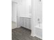 Bright bathroom featuring modern tiling, flooring, and hardware at 13279 Tula Loop, Astatula, FL 34705