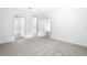 Spacious bedroom features neutral carpet, white walls, and access to closet and bathroom at 13279 Tula Loop, Astatula, FL 34705