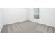 Neutral bedroom with carpeting and good natural light from a bright window at 13279 Tula Loop, Astatula, FL 34705