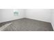 Bright bedroom with wood floors, a window, and neutral walls at 13279 Tula Loop, Astatula, FL 34705