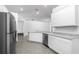 Modern kitchen with stainless steel appliances, granite countertops, and ample cabinet space at 13279 Tula Loop, Astatula, FL 34705