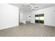 Open-concept living room with modern flooring and ample natural light at 13283 Tula Loop, Astatula, FL 34705