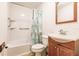 The bathroom features a shower and tub combination, toilet, sink, and a wood trimmed mirror at 4290 Trainer Rd, Bartow, FL 33830