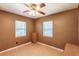 Bedroom with wood-look floors, natural light, and a small dresser at 4290 Trainer Rd, Bartow, FL 33830