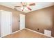 Modest bedroom features two closets for ample storage, and a ceiling fan for comfortable living at 4290 Trainer Rd, Bartow, FL 33830