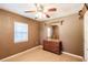 Bedroom features wood-look floors, bright windows, and a vintage wooden dresser at 4290 Trainer Rd, Bartow, FL 33830