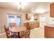 Eat-in kitchen features wood cabinets, durable countertops, and access to outdoor spaces at 4290 Trainer Rd, Bartow, FL 33830