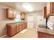 Kitchen offers ample wood cabinets, durable countertops, and a double basin sink at 4290 Trainer Rd, Bartow, FL 33830