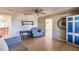 Inviting living room featuring a ceiling fan, wood-look floors, and lots of natural light at 4290 Trainer Rd, Bartow, FL 33830