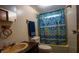 Functional bathroom with a vintage sink and patterned shower curtain at 4586 Cr 696, Webster, FL 33597