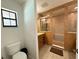 Bathroom featuring a step-in shower between the vanity and the toilet at 4586 Cr 696, Webster, FL 33597