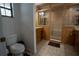 Bathroom with a toilet, vanity, and tiled walk-in shower at 4586 Cr 696, Webster, FL 33597