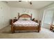 Spacious bedroom features a wooden bed frame and coordinated side tables at 4586 Cr 696, Webster, FL 33597