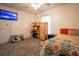 Comfortable bedroom showcases a ceiling fan, large TV and furniture with a desk area at 4586 Cr 696, Webster, FL 33597