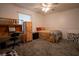 Comfortable bedroom showcases a ceiling fan and furniture with a desk area at 4586 Cr 696, Webster, FL 33597