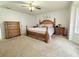 The bedroom is nicely appointed with a wooden bed frame and matching dressers at 4586 Cr 696, Webster, FL 33597