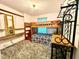Bright bedroom features a bunk bed, open shelving, stylish decor, and plenty of natural light at 4586 Cr 696, Webster, FL 33597