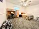 Cozy bedroom featuring a ceiling fan, desk, wood dresser, and unique cow-print ottoman at 4586 Cr 696, Webster, FL 33597
