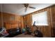 Bedroom featuring a large window, ceiling fan and workout equipment at 4586 Cr 696, Webster, FL 33597