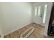 Bright entryway with a decorative front door, and wood laminate flooring at 4586 Cr 696, Webster, FL 33597