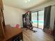 Bright home gym with sliding glass doors leading to the pool at 4586 Cr 696, Webster, FL 33597