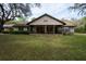 Charming single-story home with a large front yard and covered porch at 4586 Cr 696, Webster, FL 33597
