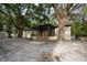 Charming single-story home with a screened porch and mature trees at 4586 Cr 696, Webster, FL 33597