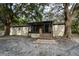 Cozy home with a screened porch nestled among mature trees at 4586 Cr 696, Webster, FL 33597