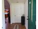 Entryway with dark green doors, and a view of the kitchen at 4586 Cr 696, Webster, FL 33597