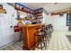 The game room features a classic wood bar and seating for a fun, social atmosphere at 4586 Cr 696, Webster, FL 33597