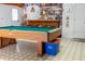 The game room includes a vintage billiard table and sports-themed wall decor at 4586 Cr 696, Webster, FL 33597