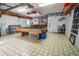 Well-equipped game room featuring a billiard table, bar area, and sports memorabilia at 4586 Cr 696, Webster, FL 33597