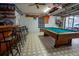 Enjoy a classic game room with a billiards table and nostalgic car racing themed decor at 4586 Cr 696, Webster, FL 33597