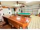 Spacious garage, featuring a custom bar and pool table, offers versatile entertainment options at 4586 Cr 696, Webster, FL 33597