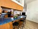 Spacious kitchen with a breakfast bar, wood cabinets, and a view to the living area at 4586 Cr 696, Webster, FL 33597