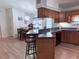 Open kitchen with breakfast bar adjoins a cozy dining area, perfect for entertaining at 4586 Cr 696, Webster, FL 33597
