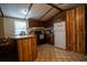 Functional kitchen features dark wood cabinets, an island bar, and appliances at 4586 Cr 696, Webster, FL 33597