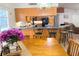 The kitchen flows into the dining area with a breakfast bar and barstool seating at 4586 Cr 696, Webster, FL 33597