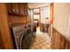 Featuring laundry machines, wood paneling and tile flooring at 4586 Cr 696, Webster, FL 33597
