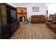 Comfortable living room featuring hardwood floors and a fireplace at 4586 Cr 696, Webster, FL 33597