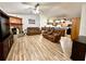 Open living room with high ceilings, fireplace, and an open layout to the kitchen at 4586 Cr 696, Webster, FL 33597