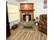 Cozy living room with a stone fireplace, wood mantle, and plush, comfortable seating at 4586 Cr 696, Webster, FL 33597