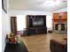 Spacious living room with hardwood floors, neutral walls, and comfortable recliner seating at 4586 Cr 696, Webster, FL 33597